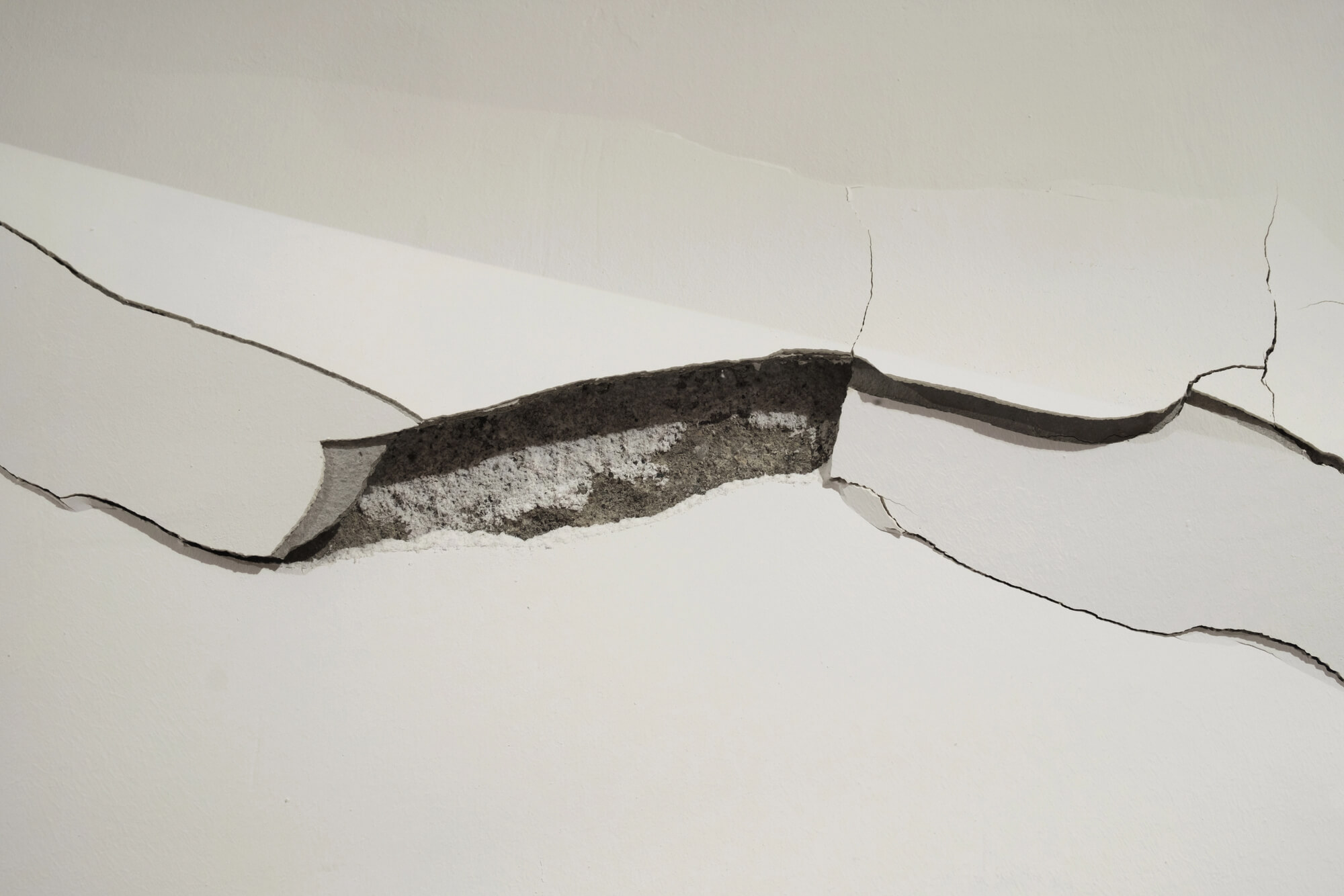 Why Cracks in Ceiling Corners Could Mean Foundation Trouble